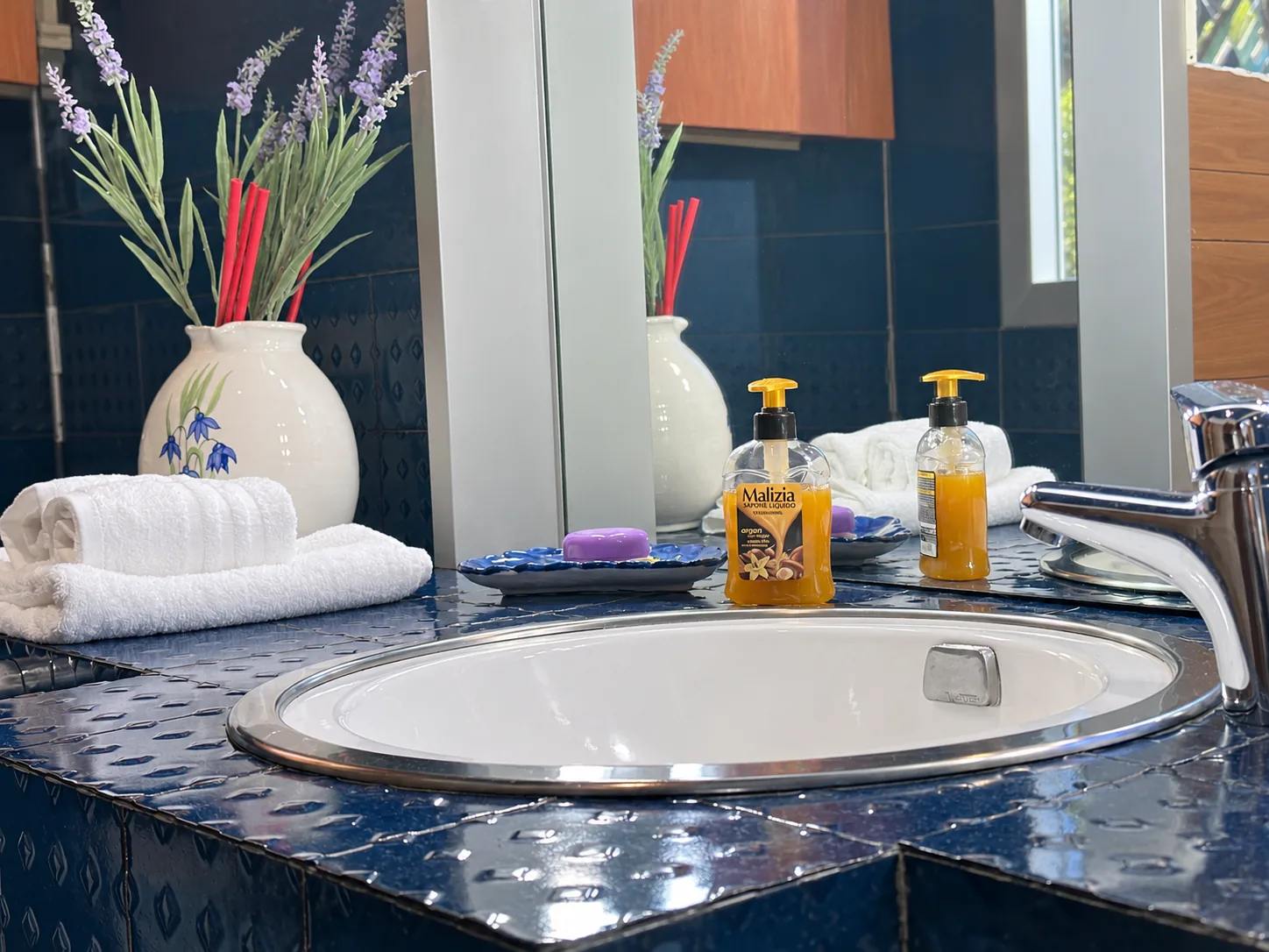 Bagno Blu sink with bathroom amenities