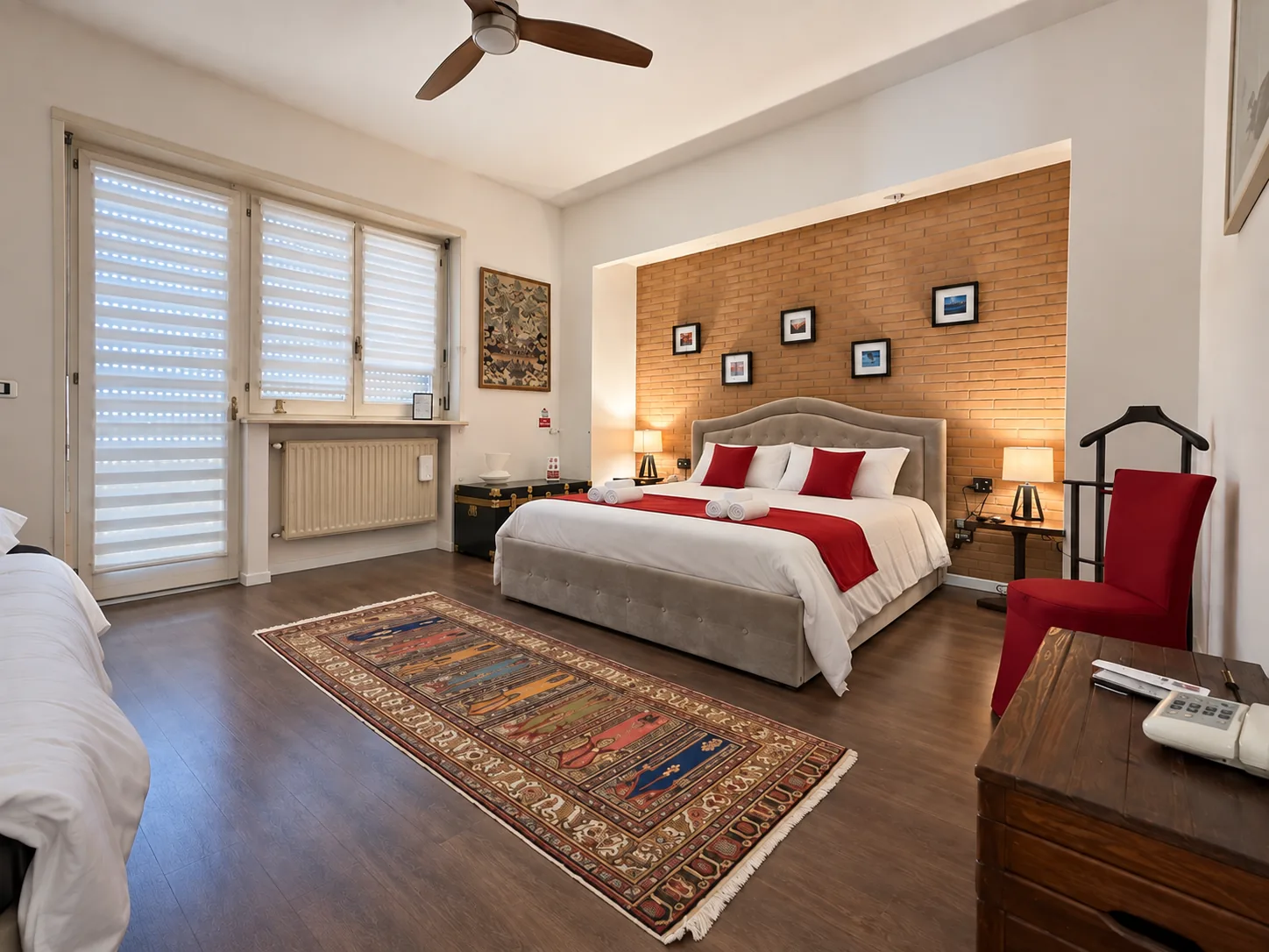 Main Bedroom with Persian rug and red armchair