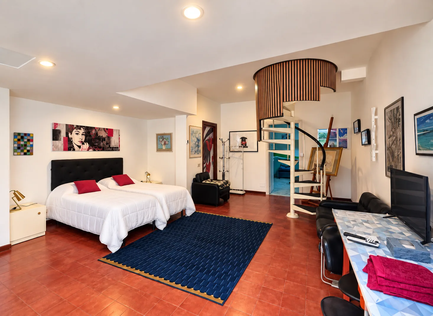 Audrey Bedroom with spiral staircase and lounge area