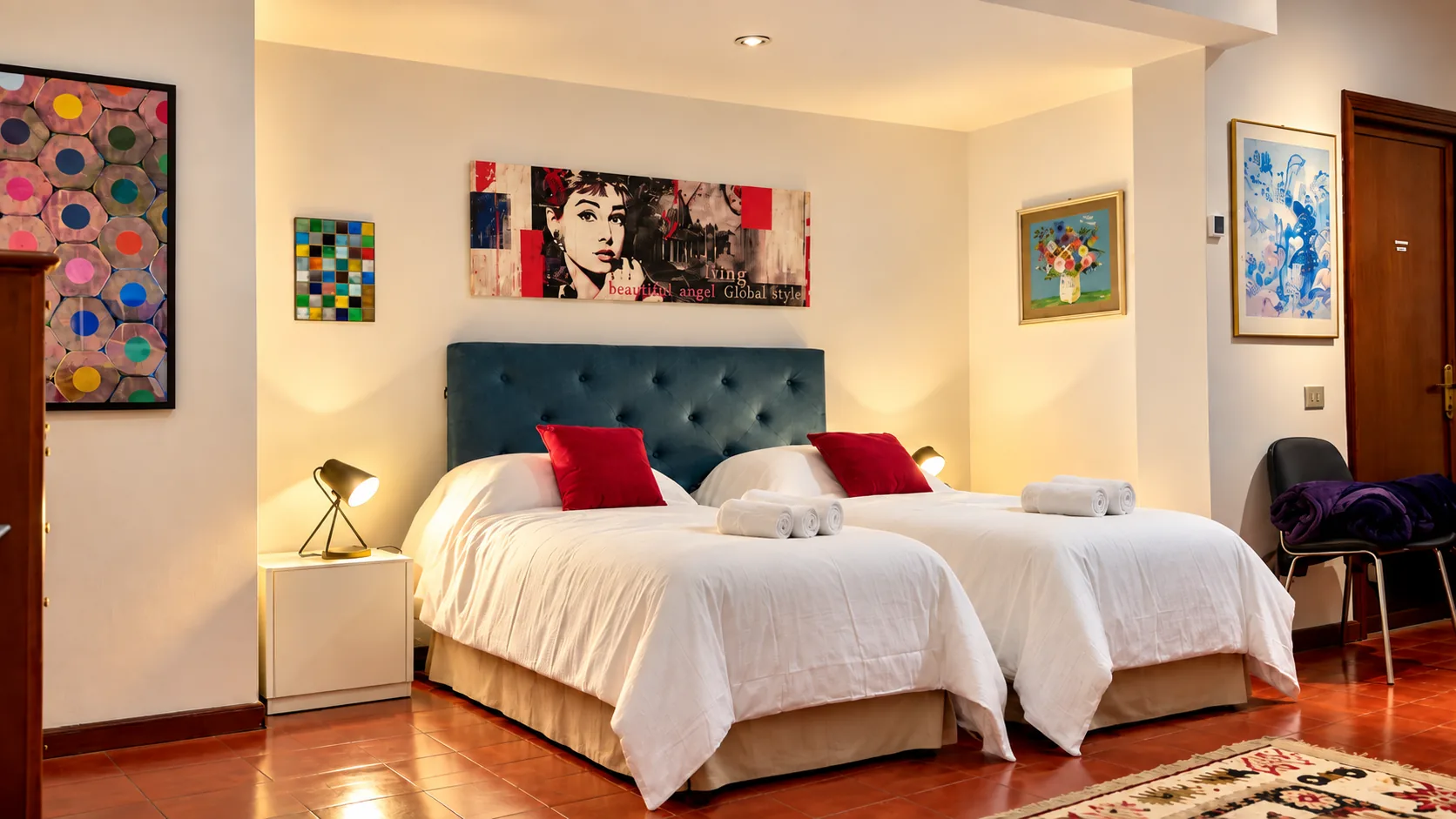 Audrey Bedroom with blue tufted headboard and twin beds