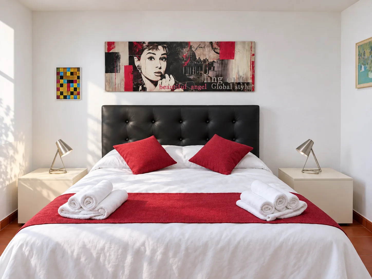 Audrey Bedroom with black tufted headboard and Audrey Hepburn print
